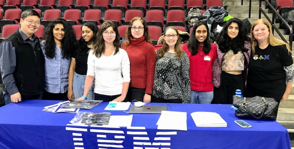 TechTogether 2020 team at the IBM table after winning the research challenge