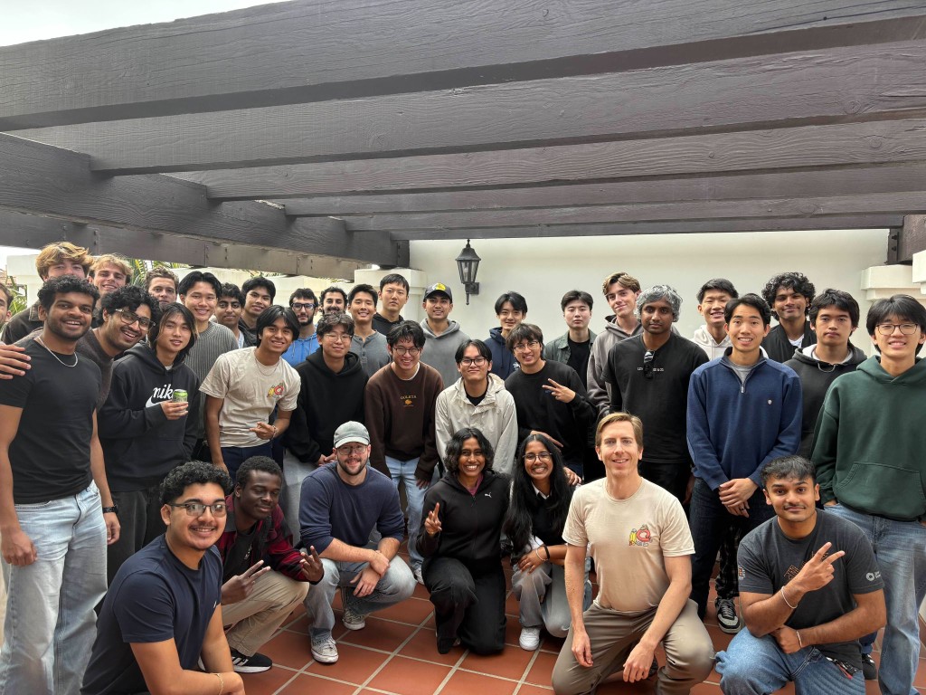 Group photo at the Unwrapathon hackathon with participants outdoors